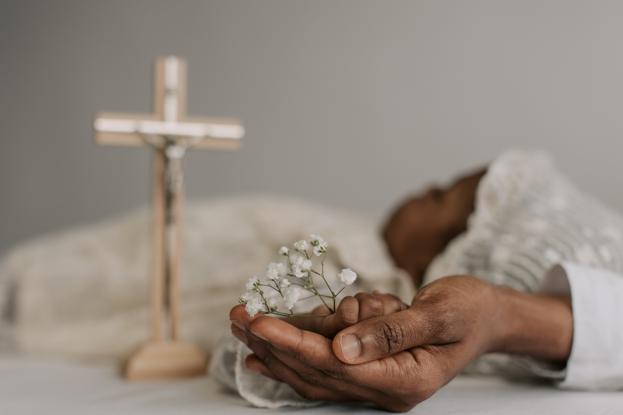 Baby Holding White Flowers